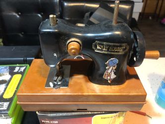 This is a vintage 1975 Holly Hobbie toy sewing machine