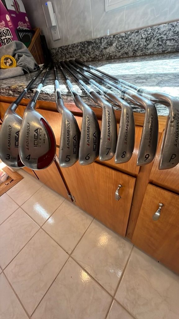 Used Adams Iron Set; 3,4,5,6 Hybrids Graphite Shafts, 7,8,9,P Steel Shafts Club Covers For The Hybrids
