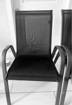 2 black chairs , sillas