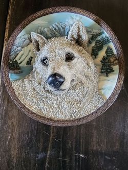 Wolf picture hangs on wall