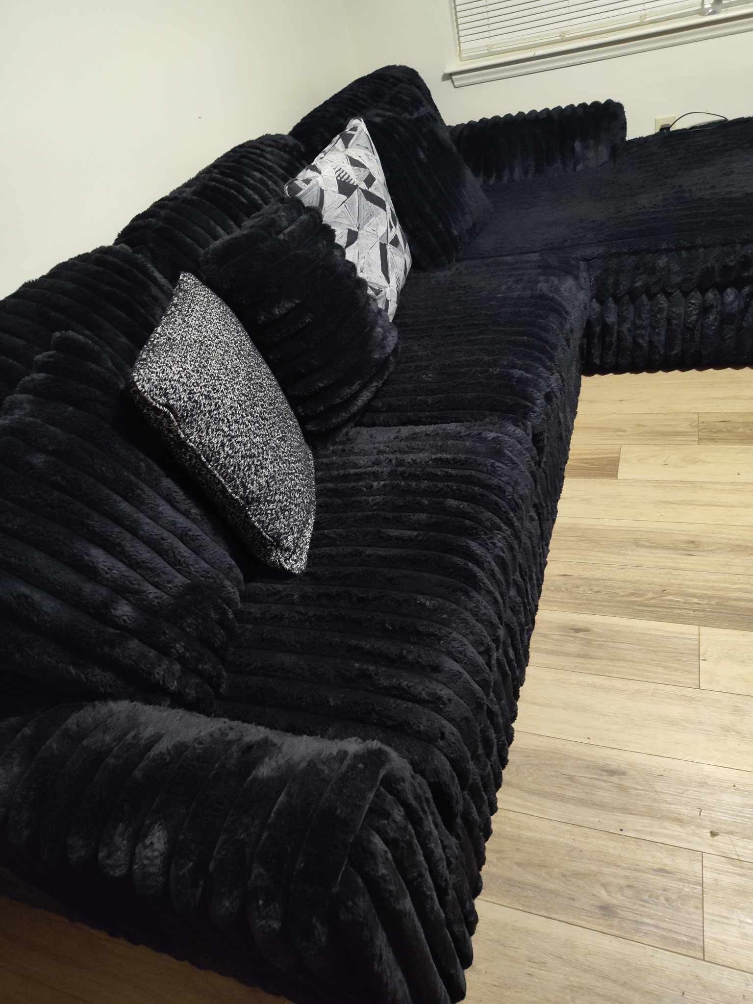 Used like new Black fluffy couch with accent pillows included