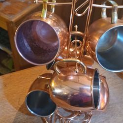 Copper Mug Stand With Random Copper Mugs And Wall Hanging Copper Decor