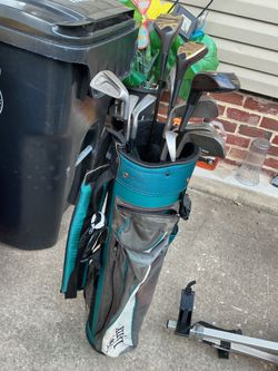 A bag full with golf items and a 2-wheel push cart (all for $60)