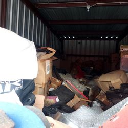 Contents Of Storage Unit Miscellaneous Items Shoes, Laptops, And More