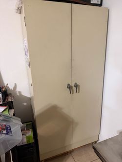 Tall Two-Door Metal Storage Cabinet on rolling base