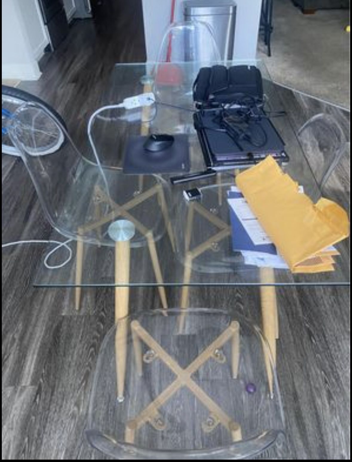 Glass Table with Plastic clear chairs