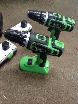 Two Kawasaki 18 V drills with 2 battery packs and charger