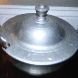 Silver soup dish with spoon and lid