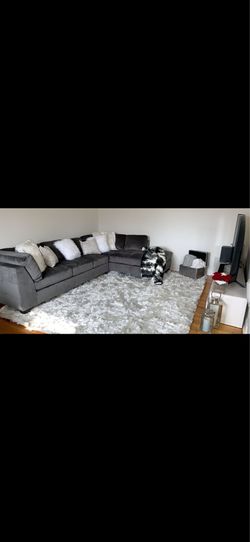 Grey sectional and ottoman