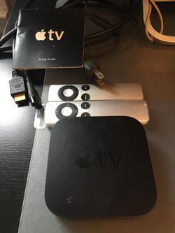 Apple TV with 2 new remotes and all necessary cables.