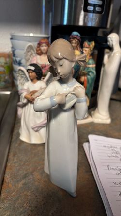 Porcelain guardian angel with child