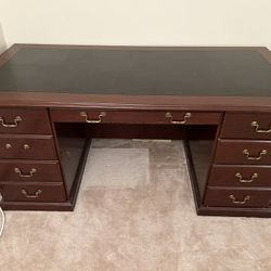 solid wood desk with brass pulls