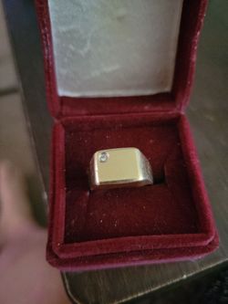 14 k gold band with cubic zirconia ring.