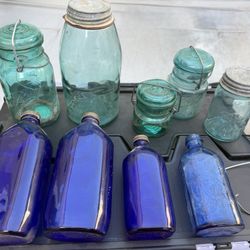 vintage milk of magnesium bottles and ball jars
