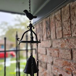 4 OUTSIDE CAST IRON  WIND CHIMES