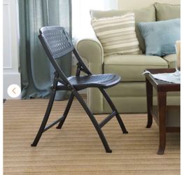 Plastic Seat Folding Chair in Black From HomeDepot 