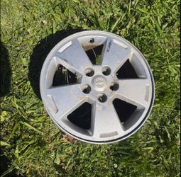 This is a 16-inch, 5-spoke silver aluminum wheel rim manufactured in for Chevrolet vehicles