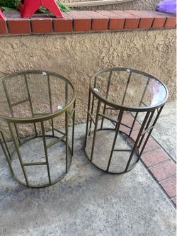 Set of two matching glass top end tables
