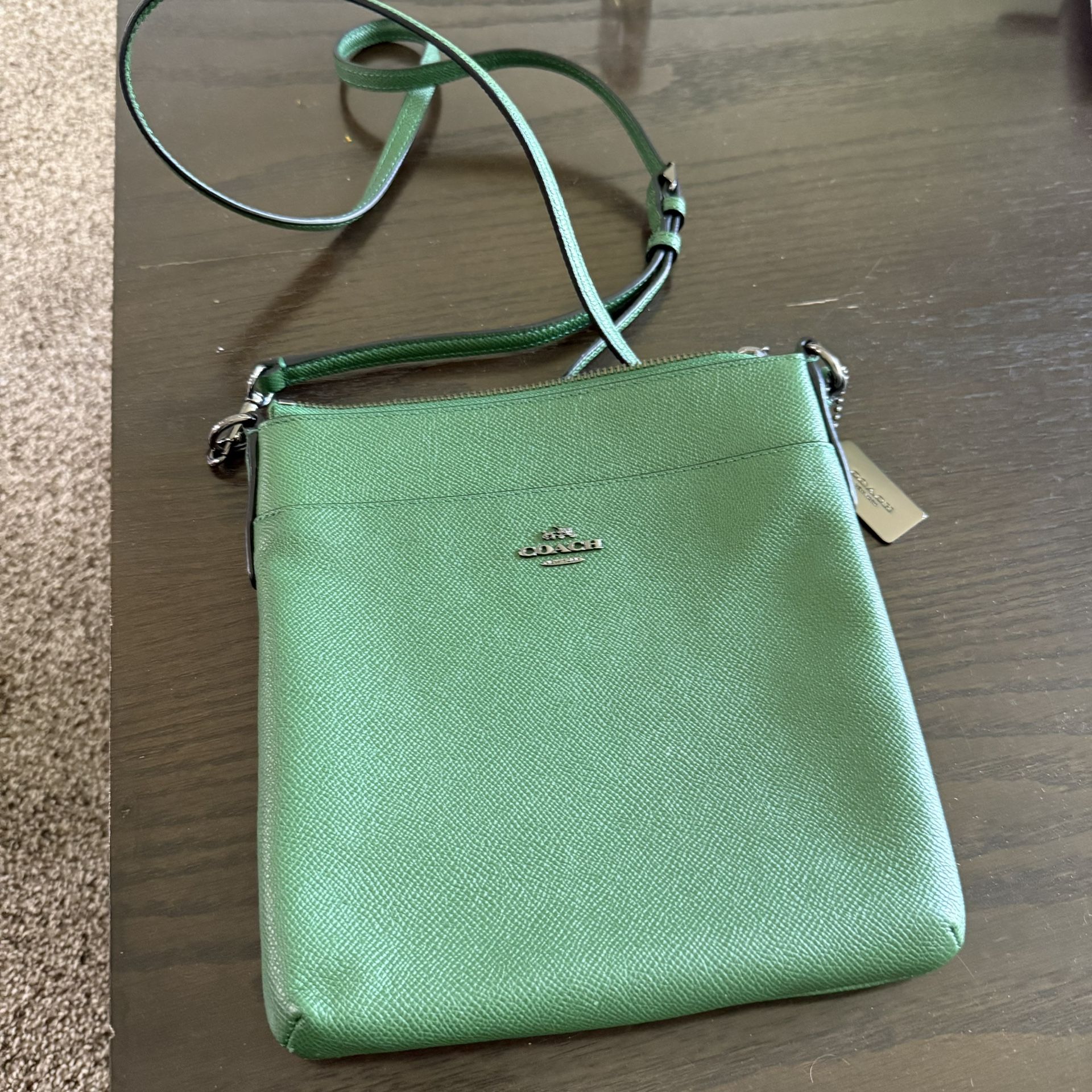 Coach Kitt Messenger Crossbody bag in green crossgrain leather.