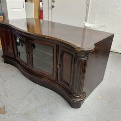 Dark Wood Entertainment Center With Serpentine Face 
