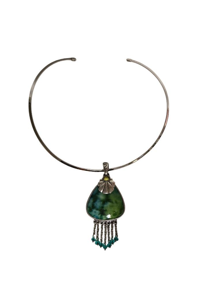 green chicos pendent with dangling silver chains and beads