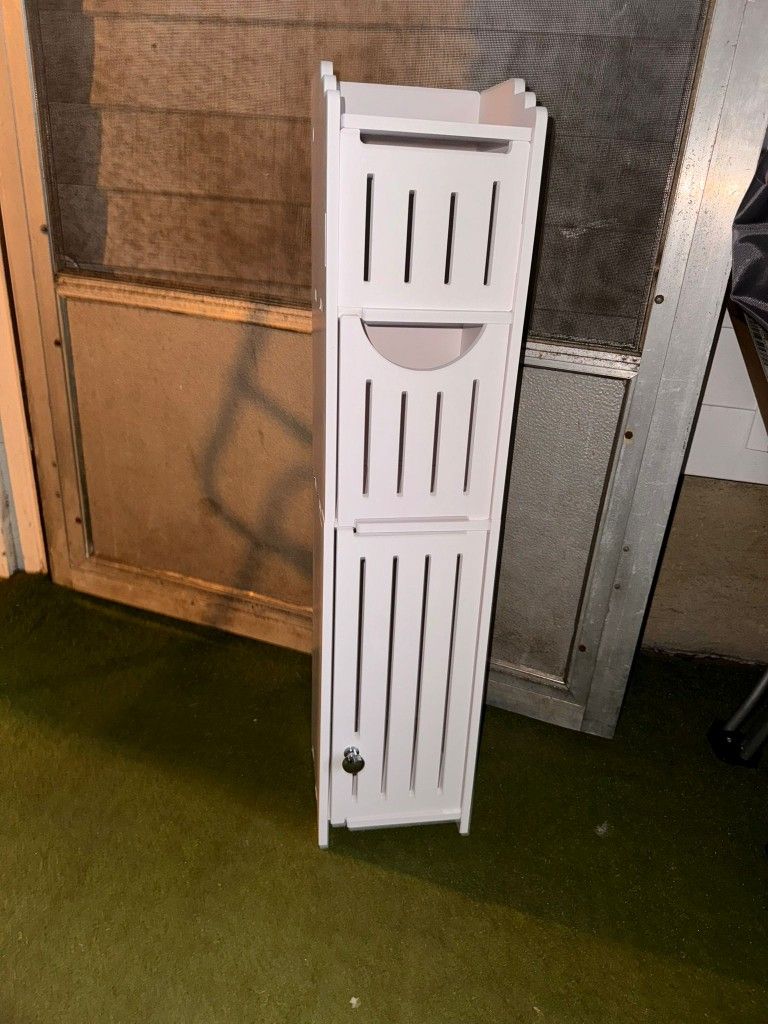 White Wooden Storage Cabinet
$25
Compact vertical storage cabinet with slatted design.