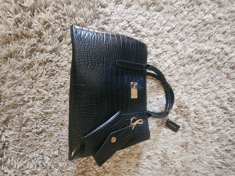 Black and gold women's handbag