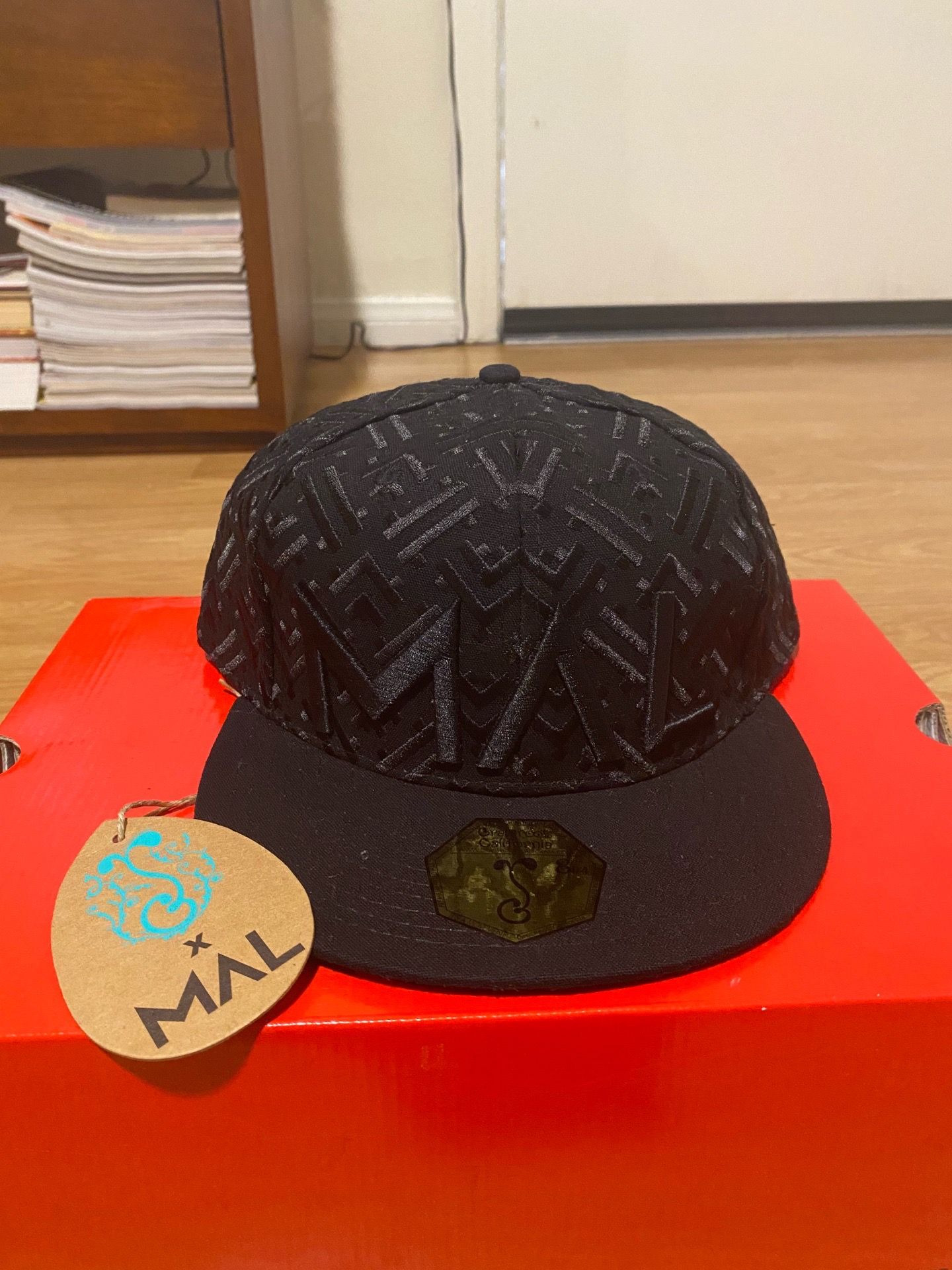 Black snapback cap w/tonal jacquard monogram MAL logo
