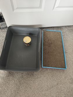 scratching post, litter box, and 2 cans of cat food, all for $10