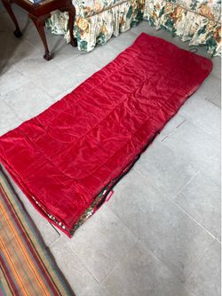 Vintage red Coleman sleeping bag