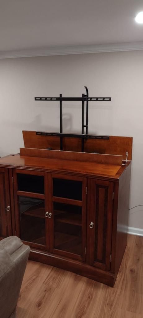 Pop up tv stand. 41.5 high 54.5 wide 28 deep. It's for a 50 inch tv.