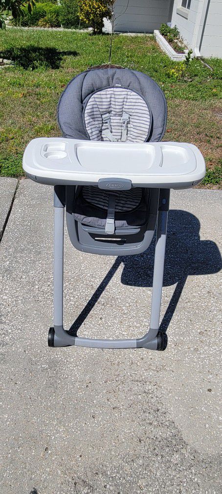 GRACO High Chair -foldable and has wheels
