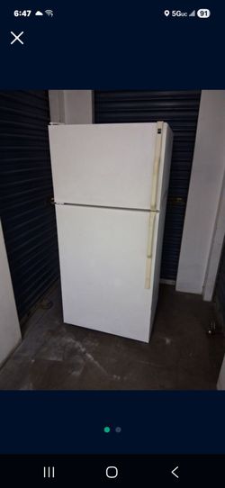 Fridge in working condition delivery available two months warranty