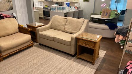 Tommy Bahama inspired loveseat, oversize chair, and two end tables with a glass toppers.