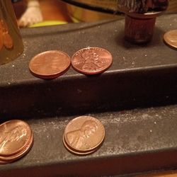 The 1975 Penny Is Twice The Thickness As The Other Pennies.