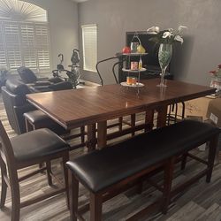 Beautiful brown table with two chairs and two bench seats
