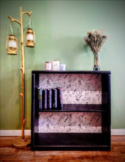 Refinished Black oak accent piece with floral back panel