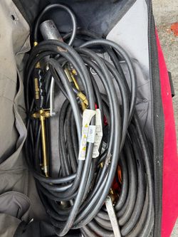 Detail/ big torch with attached hoses