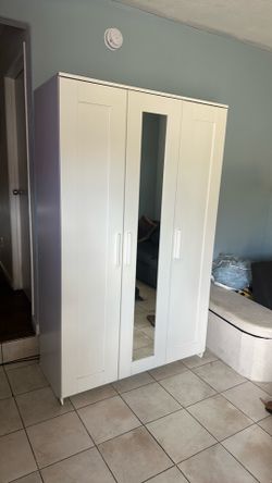 White wardrobe with three doors