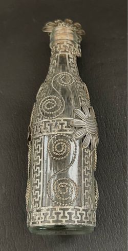 Glass bottle with silver-tone filigree