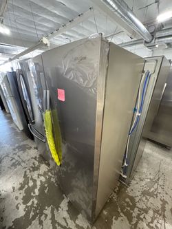 Whirlpool side-by-side refrigerator with fingerprint resistant stainless steel