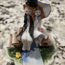 Bride And Groom Sitting On A Bench