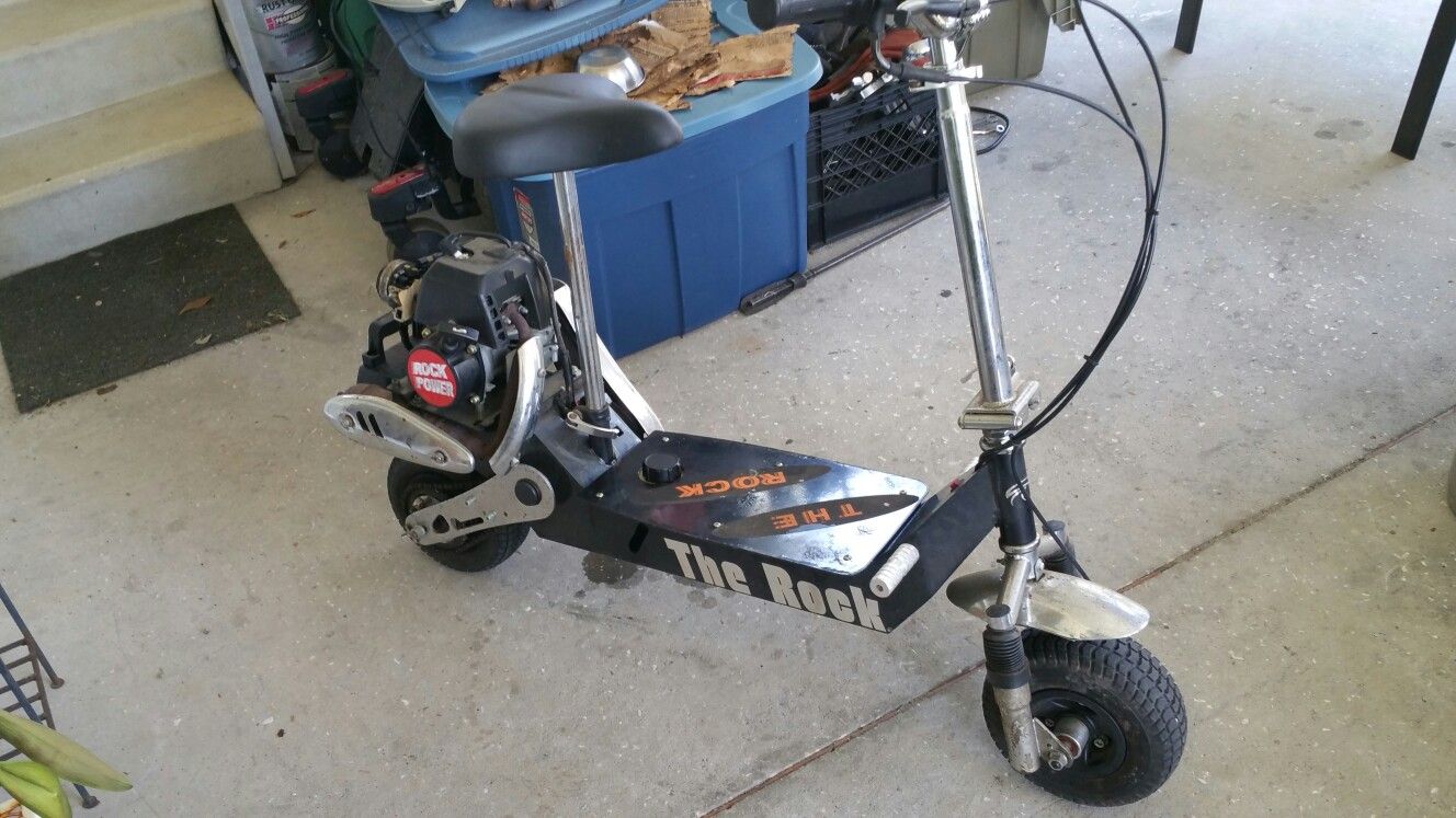 The Rock" gas scooter Deluxe model The original Eton powered scooter 41.5cc/2.2 h.p.Eton Engine. Belt/cha in Drive Adjustable & Foldable Handlebars