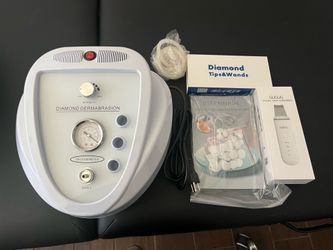 Microdermabrasion machine and facial scrubber
