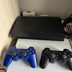 PlayStation 3 With Games And Controllers