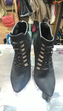 BCBG Suede leather booty heels, with zipper on tye back. Size 8 1/2 used 1 time only.