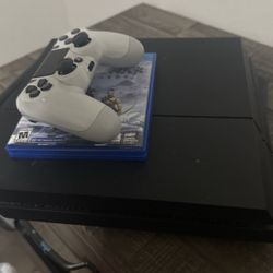 PS4 With Controller And God Of War Ragnarok