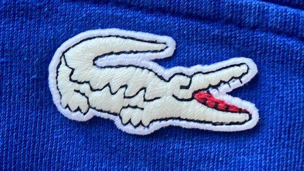 Lacoste Hoodie with 2 Side Pockets and Glow In The Dark Lacoste Logo. Size XL. Blue & Black Color