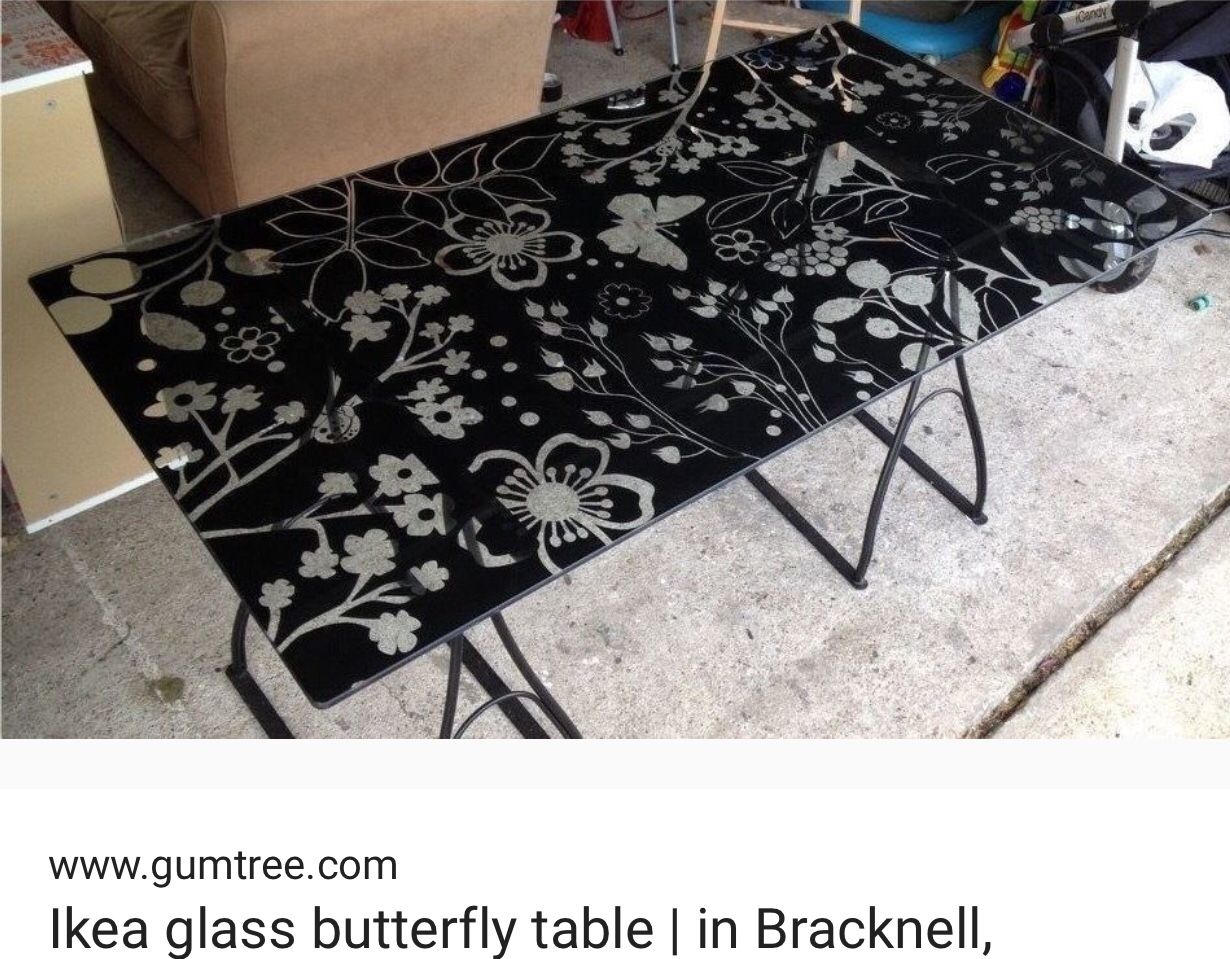 IKEA - glass top desk/butterfly pattern.