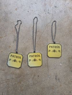 We have about 800 of these metal pendants, all with the same PATRON logo,  JUST 3 FOR $1